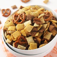 This slow cooker chex mix is super to make and is perfect for parties! Made with all-natural ingredients, this delicious snack is healthy and delicious.