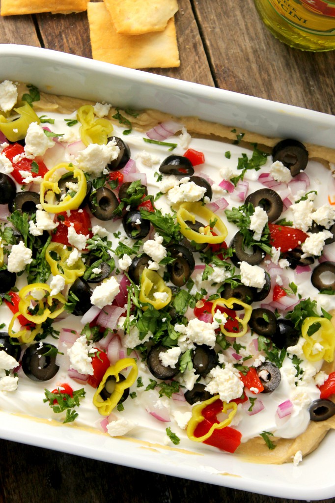 This crowd pleasing 7-Layer Greek Dip will be devoured in minutes and is super easy to make!
